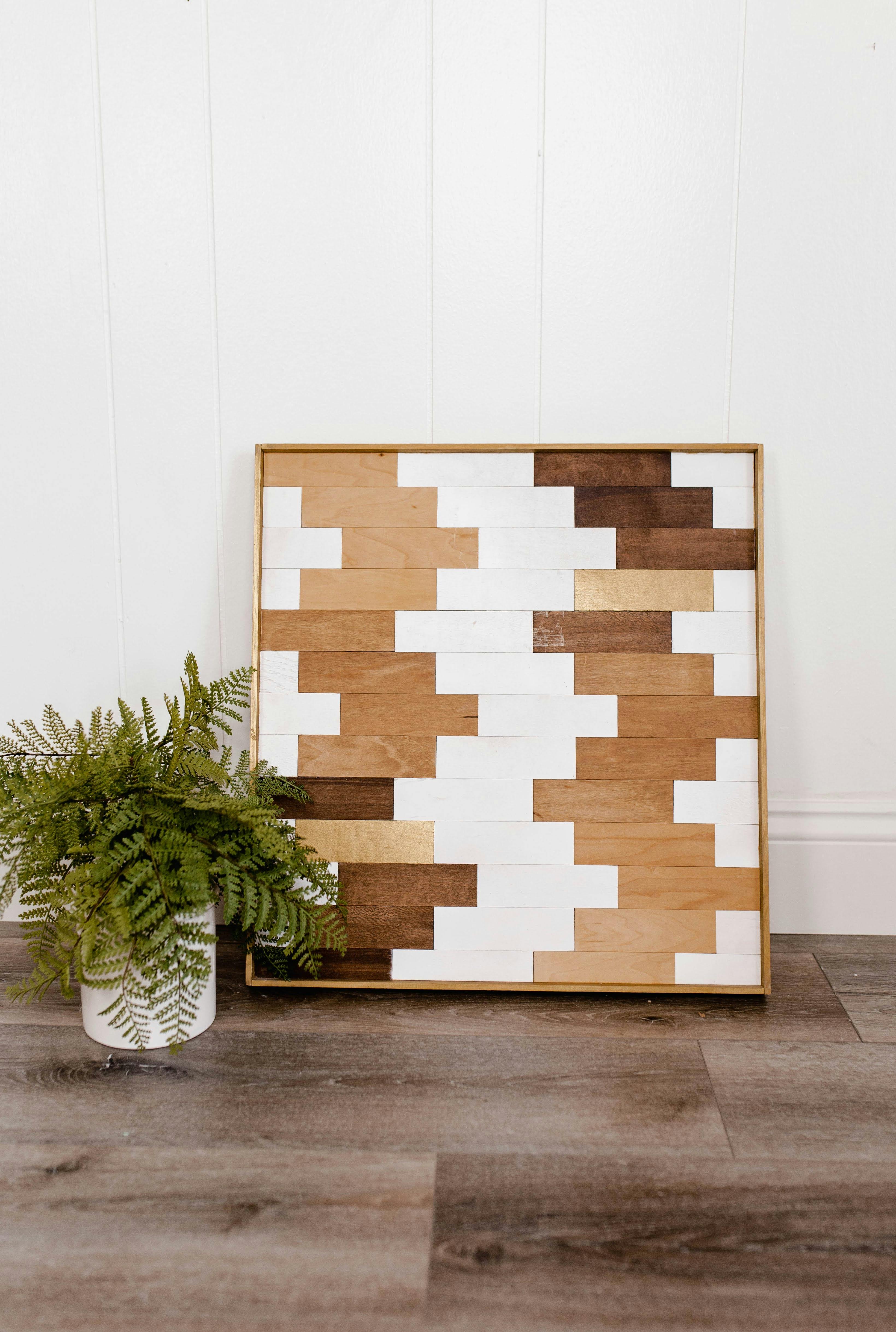 Modern geometric wood art mosaic with gold accents