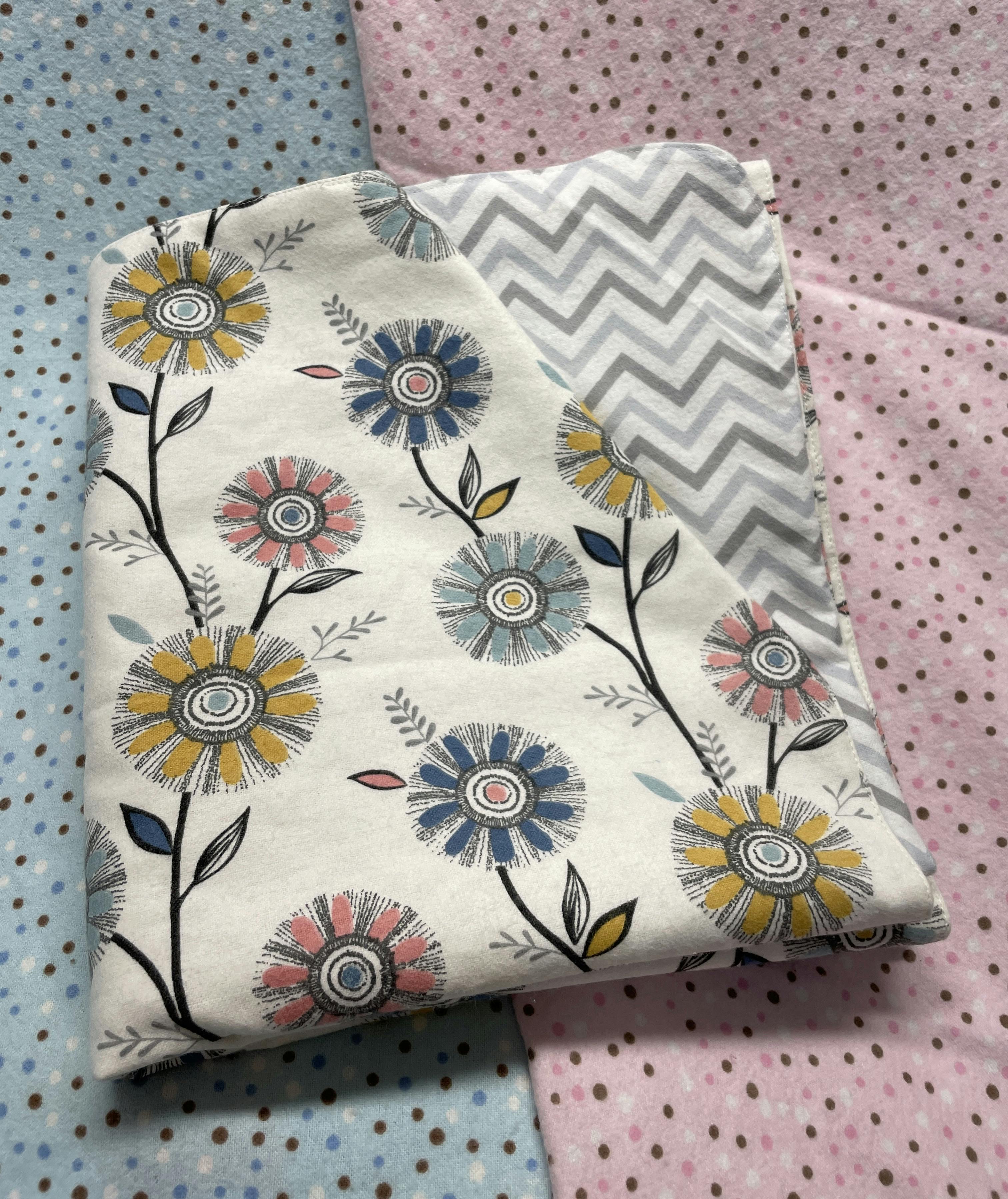 Double sided receiving baby blanket. 